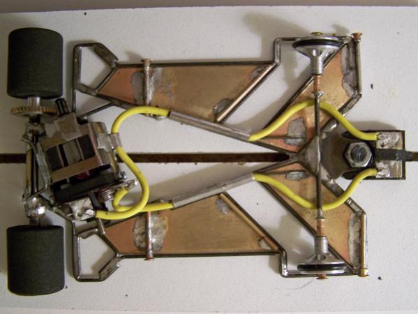 2204
1/32nd scale chassis to fit under the wide Kremer and C-100 bodies; all-wire frame (1203-style) with suspended brass plates and pans; anglewinder drive.