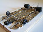 1110-A 
No-rules anglewinder chassis using 0.010 brass plate backed with 0.047 wire, adaptable to custom fit a particular body. Torsional side pans...
