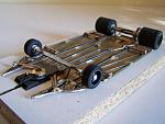 1110-B 
Ret-ro anglewinder chassis using 0.010 brass plate backed with 0.047 wire, adaptable to custom fit a particular body. Torsional side pans...