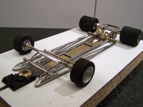 A302(F)
Ret-ro rules in-line open-wheel chassis, using two construction methods (initial hybrid-build technique chassis); all-wire outer frames and separate torsional motor-center-guide section built using 0.010 brass sheet backed with 0.047 wire. (Note: The A302(F) chassis was built to fit under the TSR Ferrari Dynamic-version body. There is also an A302(M) built to fit under the TSR Matra body that was never posted.)