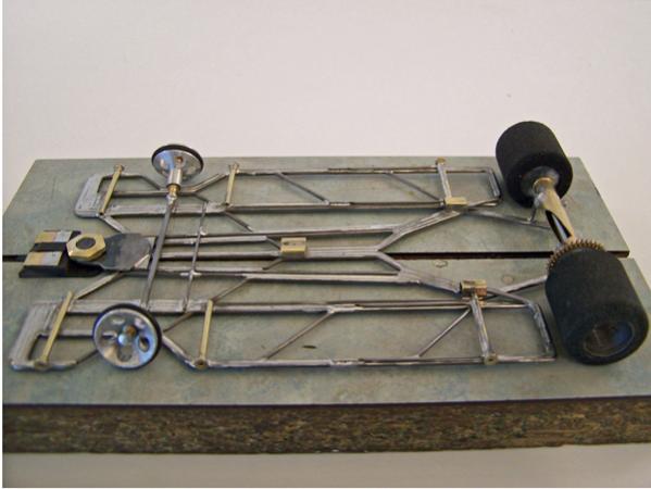 1213
Second all-wire no-rules chassis (no brass plate or sheet) with torsional wire side pans and a narrower separate center-guide section (based on 1110 chassis); anglewinder drive.