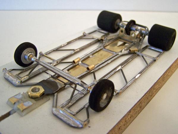 1301-C
Ret-ro rules in-line, adaptation of 1213-design, using two construction methods (hybrid-build technique); all-wire outer frames with torsional wire side pans, and separate torsional motor-center-guide section built using 0.010 brass sheet backed with 0.047 wire.