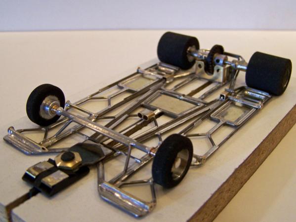 1218-C
Ret-ro rules in-line version of 1218-A chassis; all-wire frame with inner and outer torsional wire side pans, and a separate center-guide section with torsional inner sections (wire version of H cut); incorporates three 0.010 brass sheet backed with 0.039 wire pans, one at the rear of the H-center-guide section, and two at the rear of the inner wire side pans.
Winner - IRRA GT Coupe, GRRR, Viper Pit (Engelman), 3/27/10